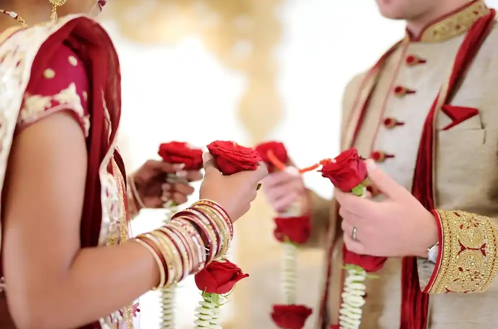 A vibrant Indian wedding ceremony featuring traditional attire, colorful decorations, and joyful participants celebrating love.